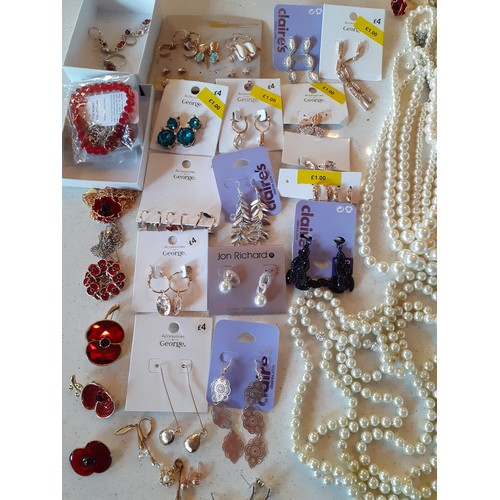 236 - A quantity of costume jewellery to include faux pearl necklaces, Poppy Appeal jewellery, a quantity ... 