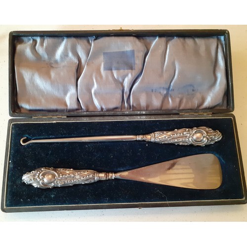 234 - Silver and white metal collectables to include a silver handled button hook and shoe horn in origina... 