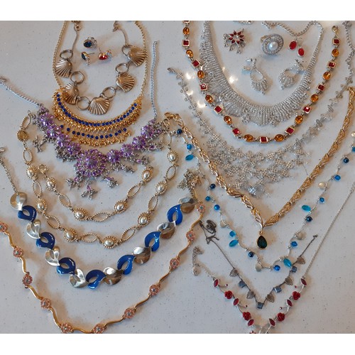 154 - A large quantity of modern costume jewellery, mainly Indian inspired bangles and gold tone necklaces... 