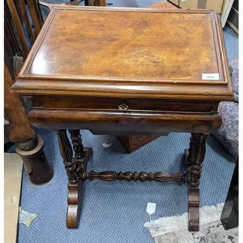 499 - A late 19th century French walnut work/sewing table having a hinged top, fitted compartments and dra... 