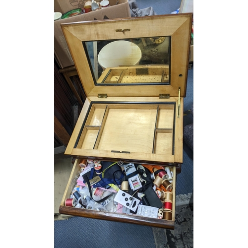 499 - A late 19th century French walnut work/sewing table having a hinged top, fitted compartments and dra... 