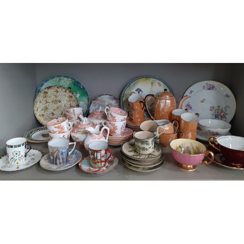 547 - A collection of decorative coffee cans and tea cups with saucers and miscellaneous collectors plates... 