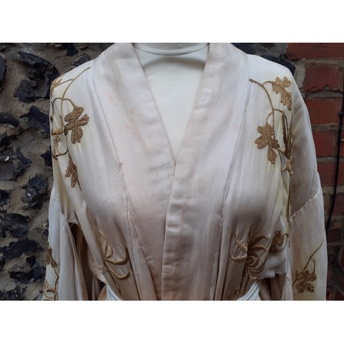 239 - An early 20th Century Japanese pale gold silk ground Kimono with sash belt and ombre effect to the m... 