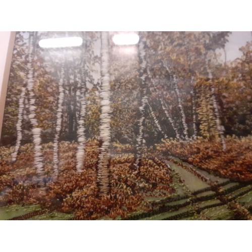 261 - Three embroidered country scenes 14x10cm having trees in the background using various stitching tech... 