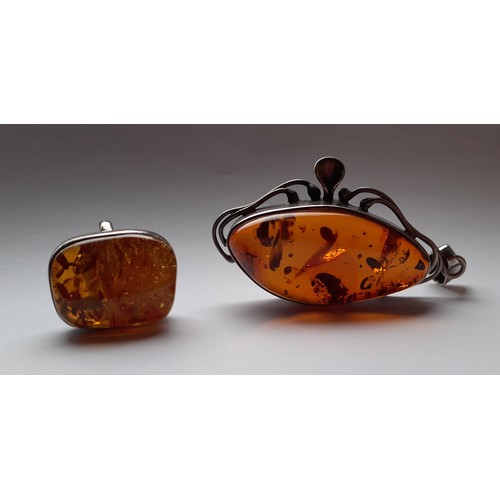 270 - A quantity of costume jewellery to include a Modernist white metal and amber pendant and ring, a whi... 