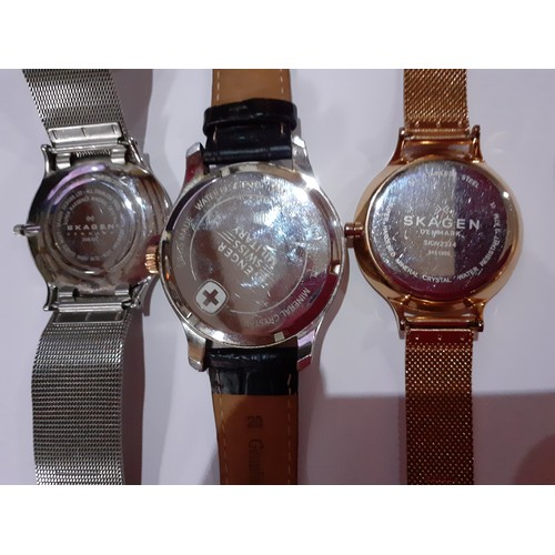 269 - Three modern watches comprising a gold tone and brushed steel Wenger Swiss Military watch with brown... 