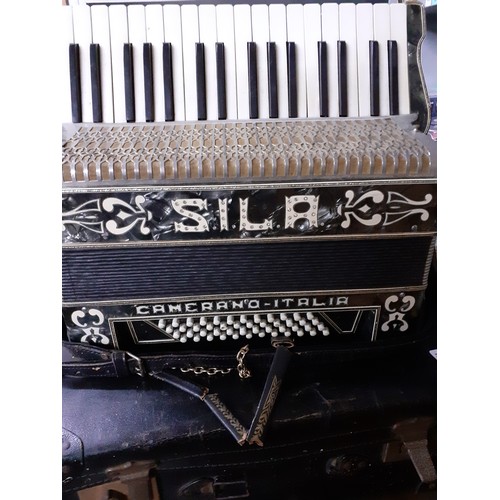 168 - A Sila of Camerano, Italy piano accordion in case having 34 keys and 48 buttons in a black finish.
L... 