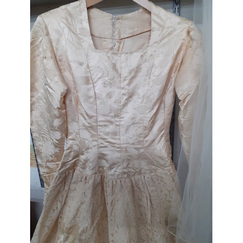 290 - A 1920's cream silk wedding dress A/F with machine embroidered floral design and button fastening to... 