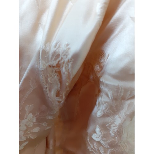 290 - A 1920's cream silk wedding dress A/F with machine embroidered floral design and button fastening to... 