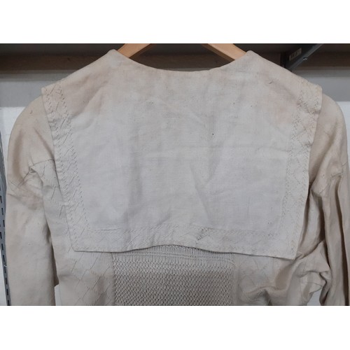 288 - A 19th Century taupe farmer's cotton twill smock, 38