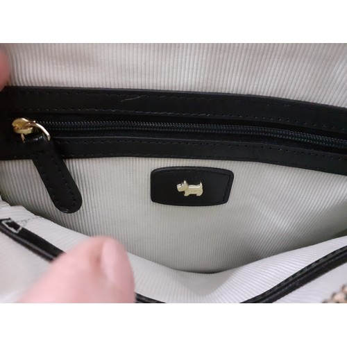 287 - Radley-A small black leather crossover bag with branded dust-bag. Location:
Condition: No damage or ... 