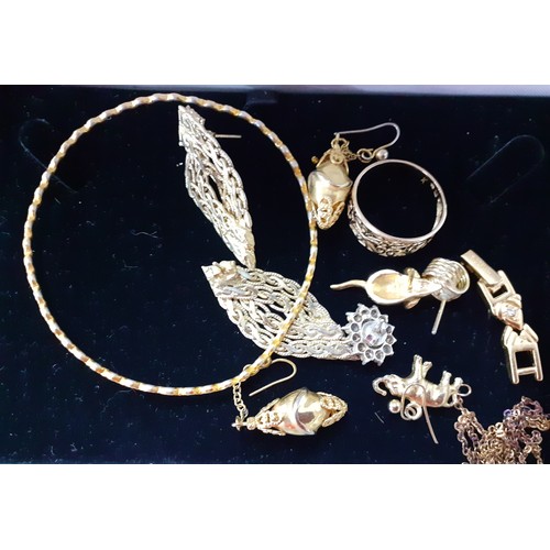 154 - A large quantity of modern costume jewellery, mainly Indian inspired bangles and gold tone necklaces... 