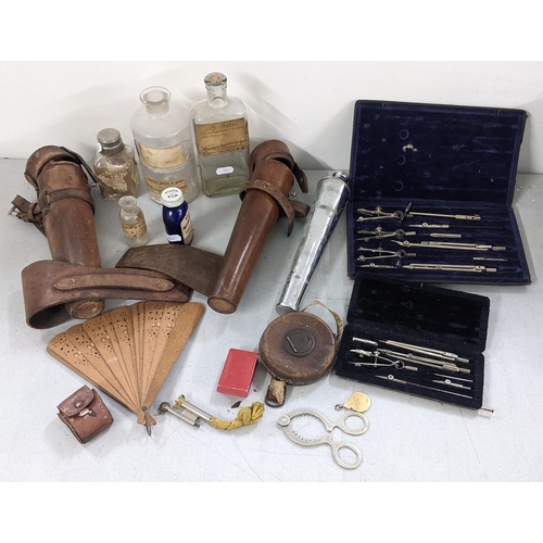 349 - A mixed lot to include a silver plated egg topper, a leather cased hunting flask, pharmacy bottles a... 