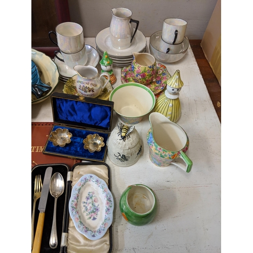 381 - A mixed lot of china and ceramics to include a picture of a young girl, a Holy Bible, Barker Bros, W... 