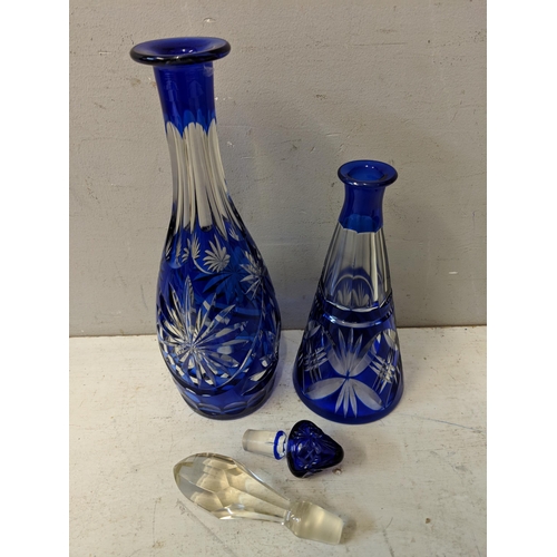 382 - A clear and blue glass tray, and two similar decanters with line cut decoration Location 4.3