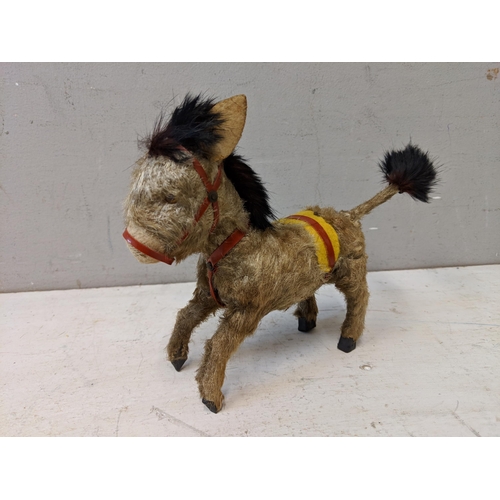 383 - A 1950's Steiff Terry Airdale terrier dog, 17cm high, and a toy donkey with moveable back legs
Locat... 