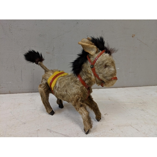 383 - A 1950's Steiff Terry Airdale terrier dog, 17cm high, and a toy donkey with moveable back legs
Locat... 