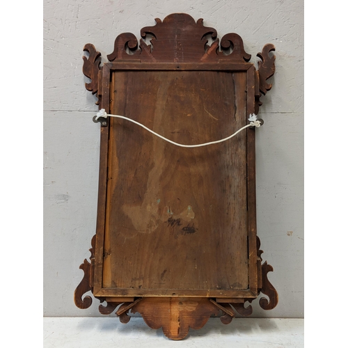 449 - A 19th century mahogany wall mirror in a decoratively carved frame
Location:RWF