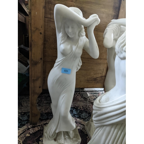 542 - A group of contemporary resin Parian ware style conservatory statues of three semi-clad maidens on s... 