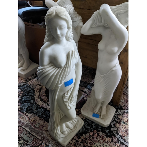 542 - A group of contemporary resin Parian ware style conservatory statues of three semi-clad maidens on s... 