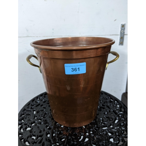 544 - A copper and brass twin handled brass wine cooler
Location: G (store - back right shelf)