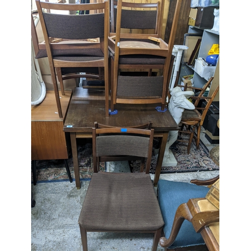 536 - A mid century teak extending dining table on square legs, 71.5cm x 84cm x 76cm (when extended) along... 