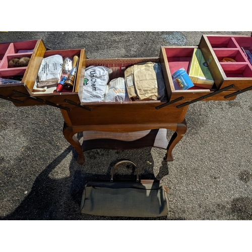 530 - An early 20th century mahogany sewing box with cantilevered top, on cabriole legs, fitted interior w... 