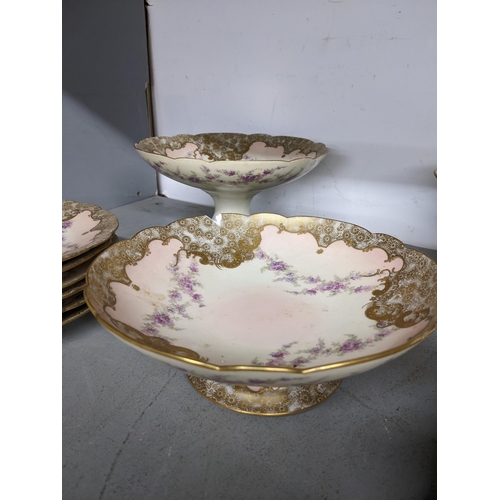 406 - Late 19th/early 20th century Limoges porcelain dessert service decorated with flowers comprising thr... 