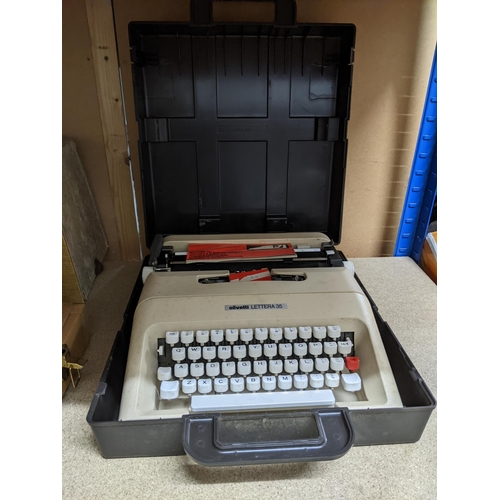 413 - A mixed lot to include a cased Olivetti Lettera 35 typewriter, cased Singer 99K 'Red S' sewing machi... 