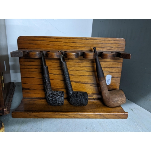 427 - An oak smoker's cabinet with bevelled glass panelled front, fitted interior with drawers, and tobacc... 