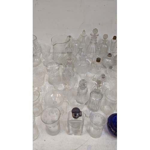 301 - Mixed early 20th century and later glassware to include a ring collared decanter, scent bottles and ... 