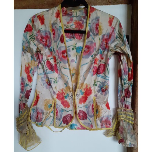 273 - A vintage silk blouse A/F having a multi-coloured floral pattern throughout with yellow piping to th... 