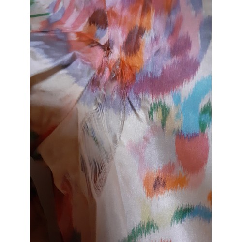 273 - A vintage silk blouse A/F having a multi-coloured floral pattern throughout with yellow piping to th... 