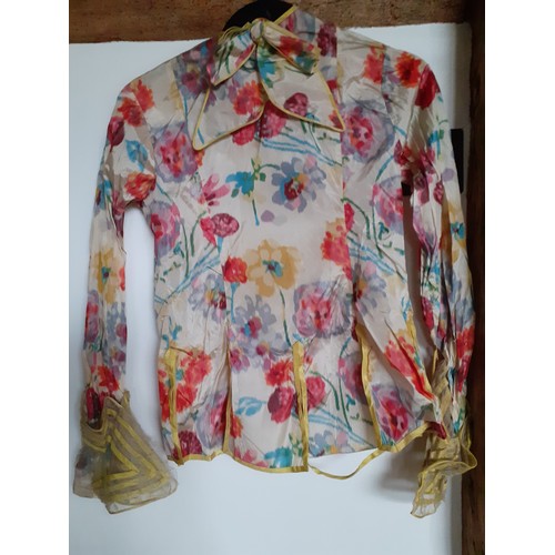 273 - A vintage silk blouse A/F having a multi-coloured floral pattern throughout with yellow piping to th... 