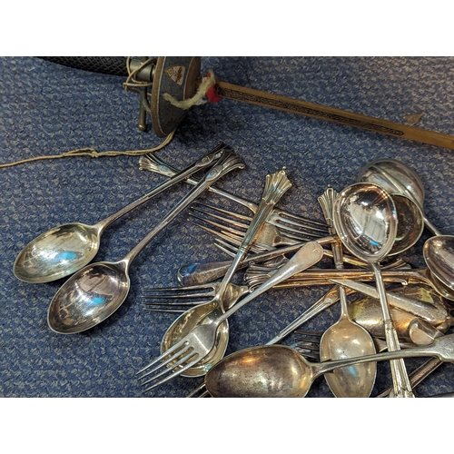 588 - A selection of mixed silver plated flatware to include forks, spoons, scissors, and others, along wi... 