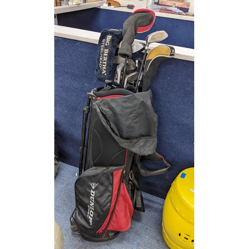 598 - A set of Dunlop golf clubs with golf bag
Location: A3F