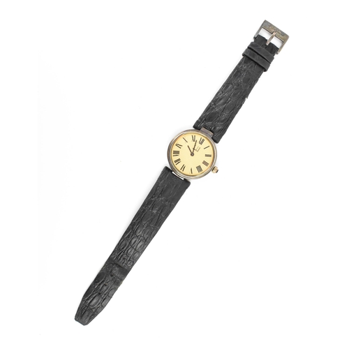 601 - A Dunhill, quartz, ladies, silver gilt wristwatch, having a textured gilt dial, Roman numerals, on a... 