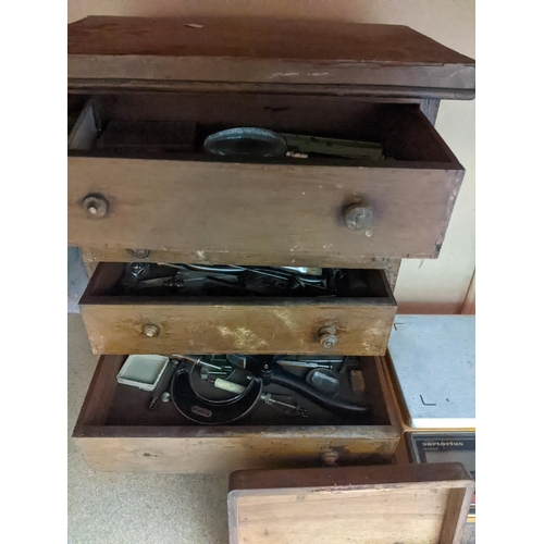 437 - A quantity of watch and engineering tools, mostly contained in two wooden tool cabinets, along with ... 