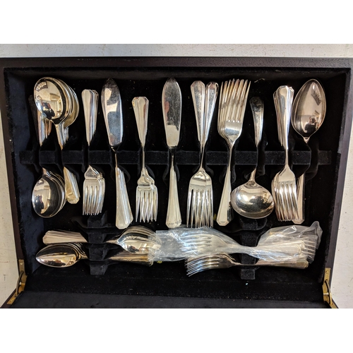 513 - A silver plated twelve-place setting canteen of cutlery in a mahogany finished case Location:A1M