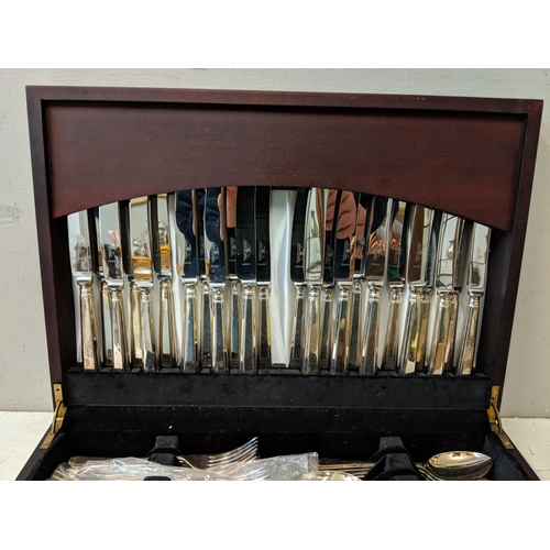 513 - A silver plated twelve-place setting canteen of cutlery in a mahogany finished case Location:A1M