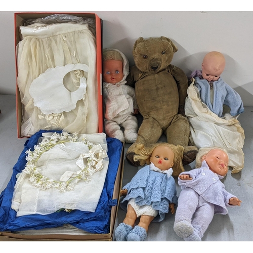 519 - A mixed lot to include an early century mohair and wood wool filled bear with growler, wedding veils... 