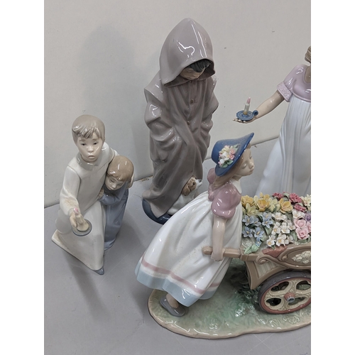 562 - A group of three Lladro figures to include 'Loves Tender Token', 'To Light the Way' A/F, boy and gir... 