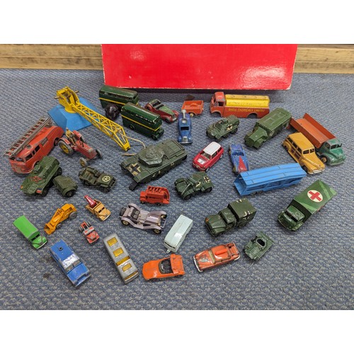 610 - A collection of mixed vintage Dinky, Corgi, Matchbox and other model vehicles to include, Dinky Army... 