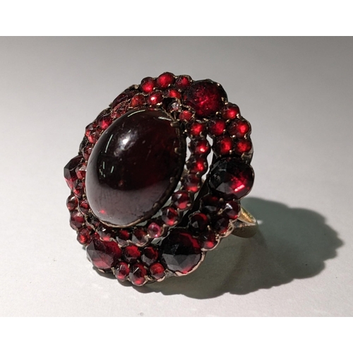 101 - A 19th century garnet set ring converted from a brooch, with a yellow metal shank, 7.3g
Location: CA... 