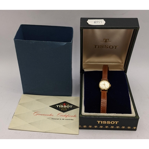 102 - A ladies Tissot gold plated manual wind wristwatch, with original box and paperwork
Location: