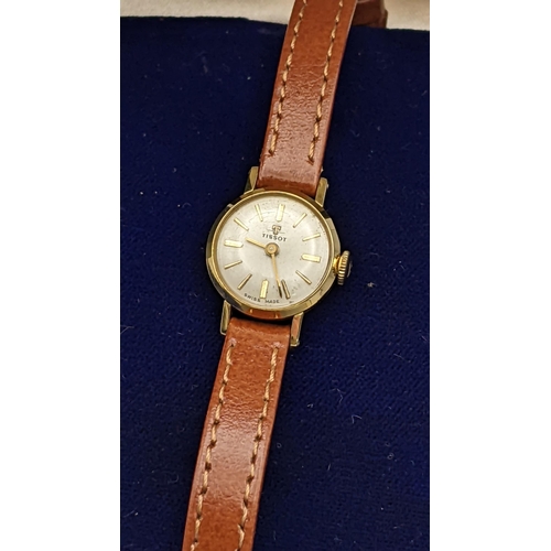 102 - A ladies Tissot gold plated manual wind wristwatch, with original box and paperwork
Location: