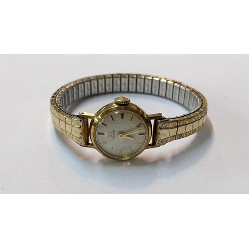 116 - A vintage Tissot 9ct gold manual wind wristwatch on a gold plated expanding bracelet
Location: CAB2