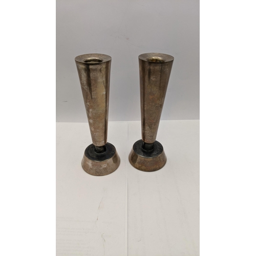 119 - A pair of white metal candle stick holders, total weight 162g
Location: