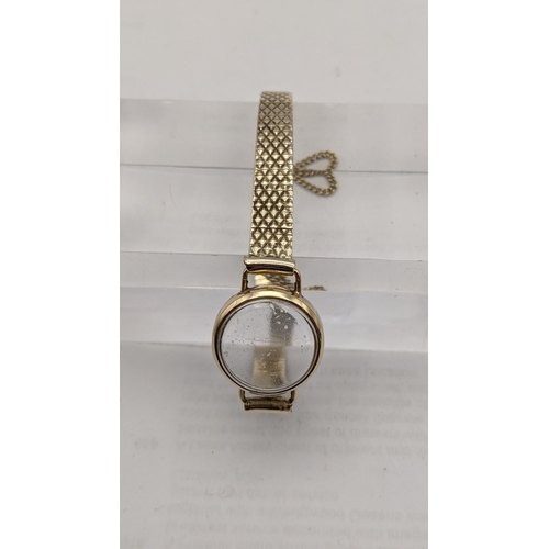 129 - A 9ct gold wrist watch bracelet with its watch face total weight 14.3g
Location: CAB3