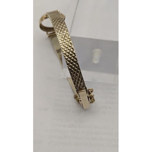 129 - A 9ct gold wrist watch bracelet with its watch face total weight 14.3g
Location: CAB3